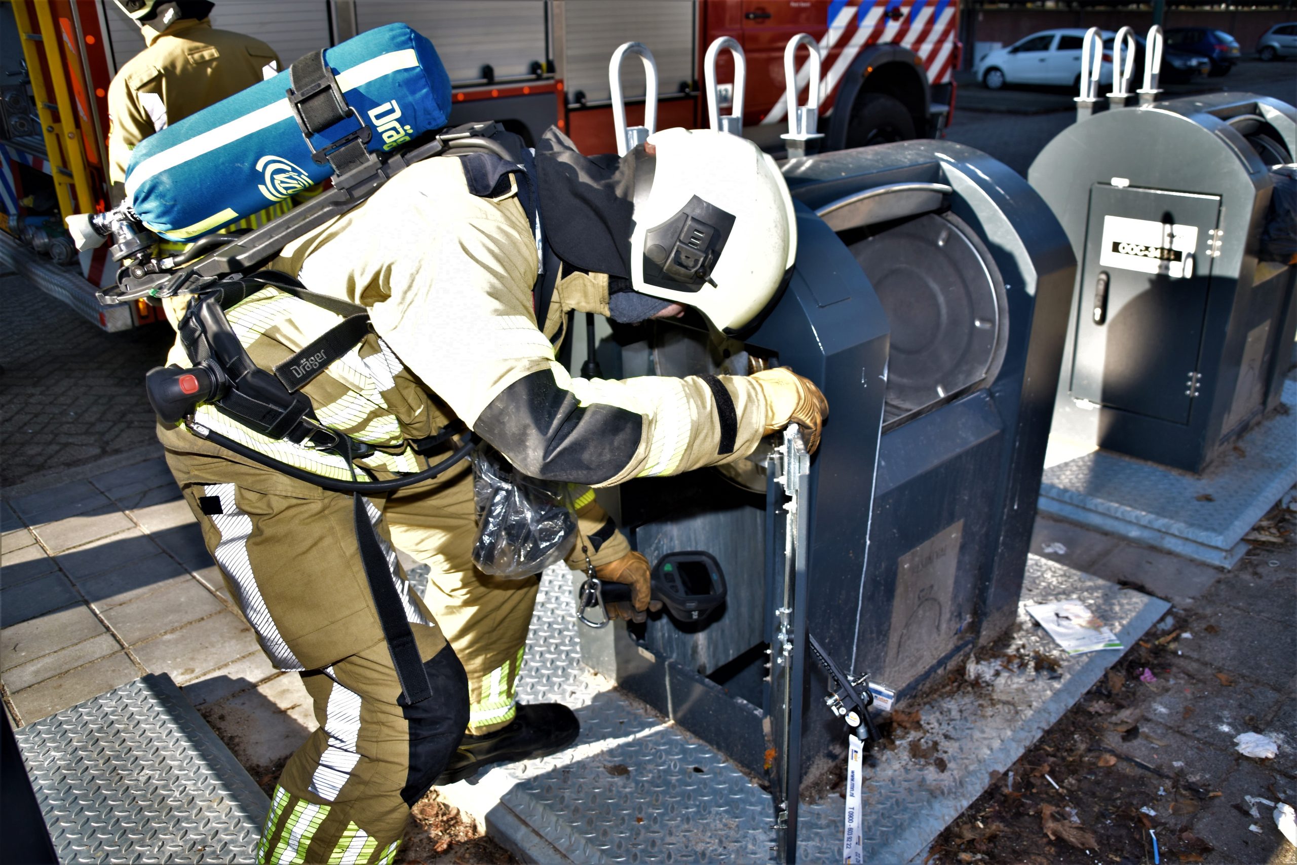 Smeulbrand in ondergrondse huisvuilcontainer